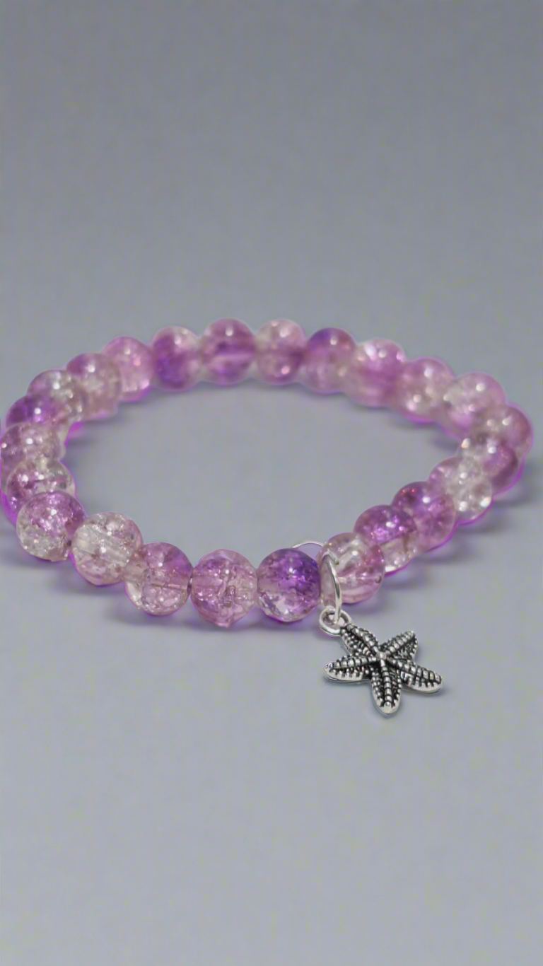 bracelets Multiple beaded, each with distinct colors and charms.