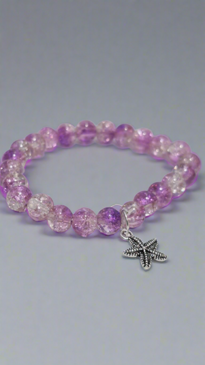bracelets Multiple beaded, each with distinct colors and charms.