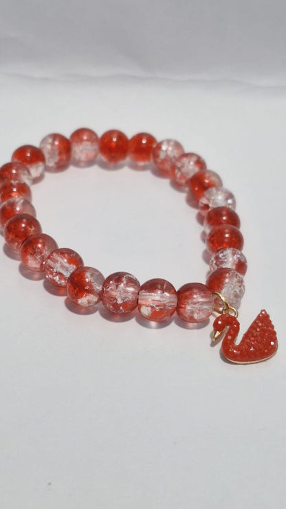 bracelets Multiple beaded, each with distinct colors and charms.