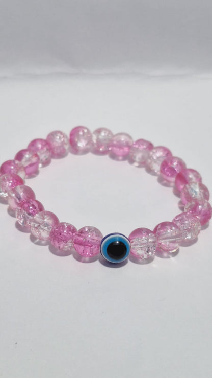 bracelets Multiple beaded, each with distinct colors and charms.