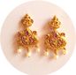 Exquisite Temple Earrings Adorned with Radiant Pink Ruby Stones